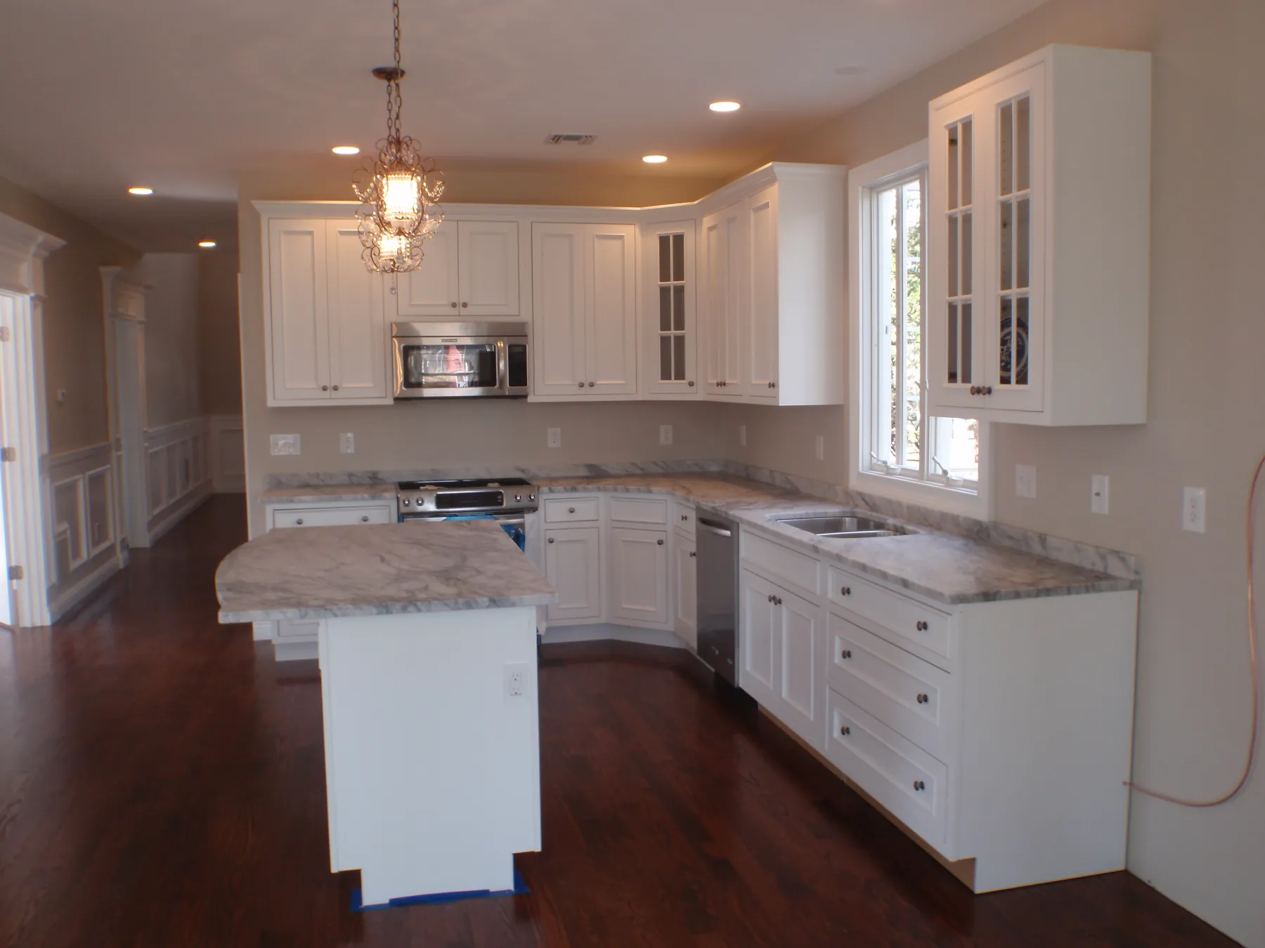 White kitchen with marble island